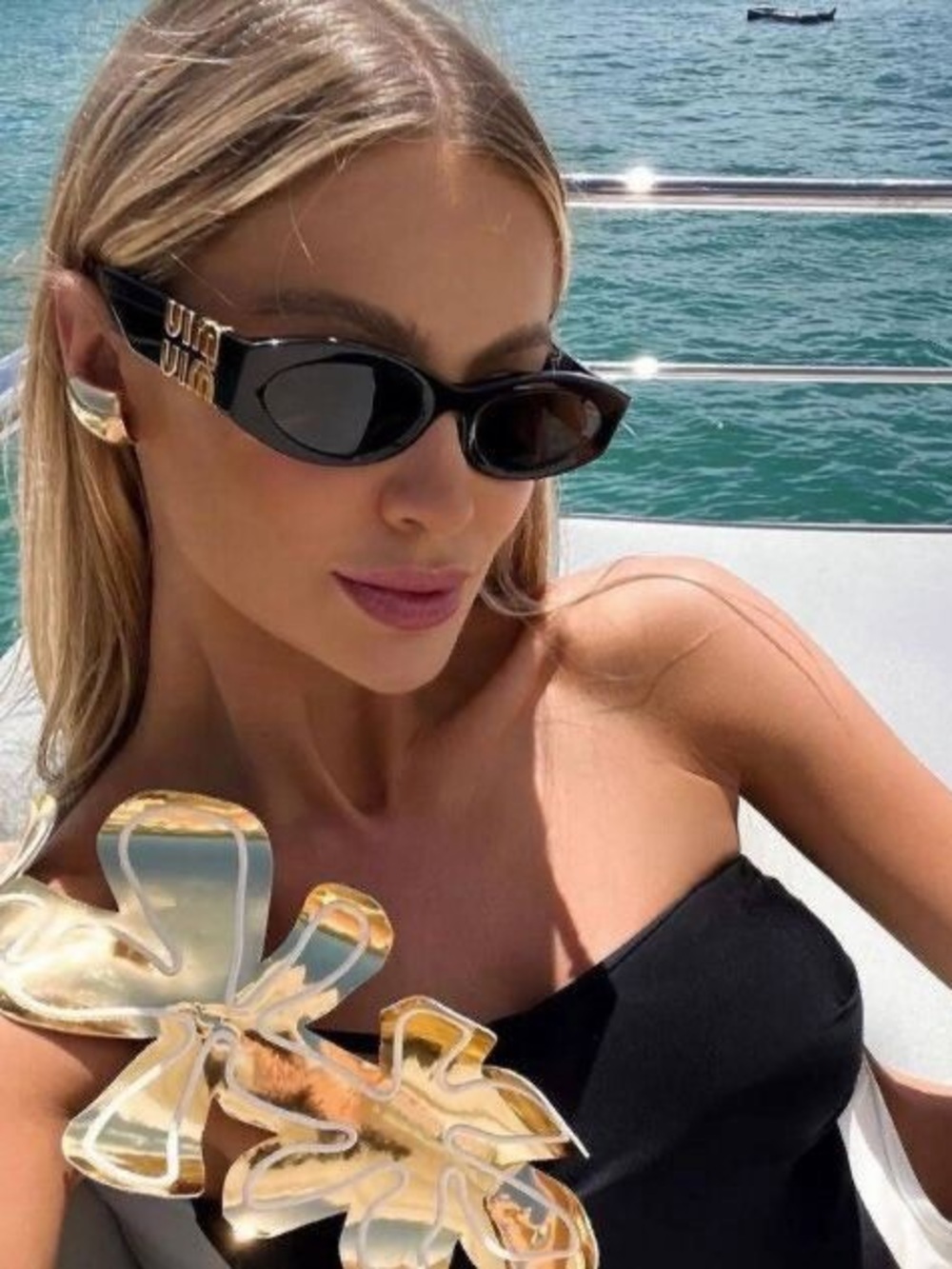 Miu Miu Black Oval Sunglasses